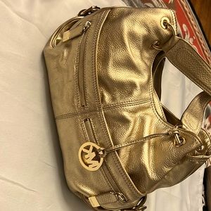 Used Michael Kors gold color women bag